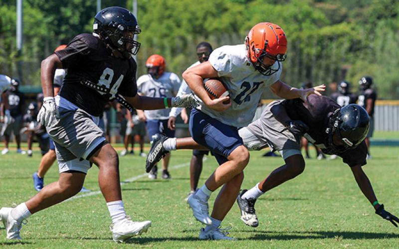 Habersham Central’s Hudson Barnett sheds off a defender during the FCA Team Camp at Piedmont University on Tuesday, July 15. (Landen Todd/Staff)