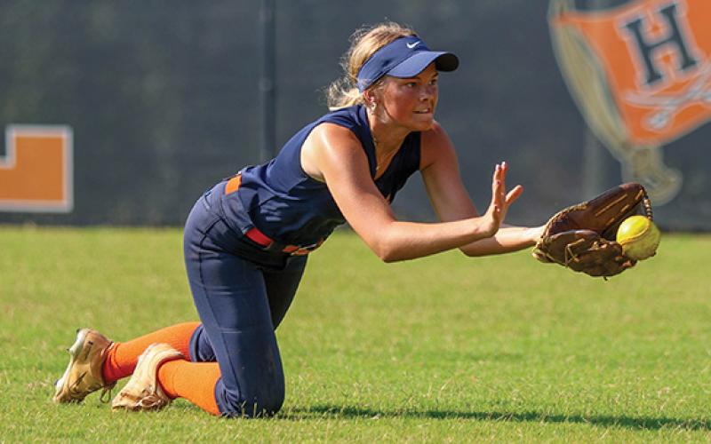 Habersham Central’s Kaylan Barrett makes a diving catch during softball practice at Raider Field on Monday, July 7. (Landen Todd/Staff)