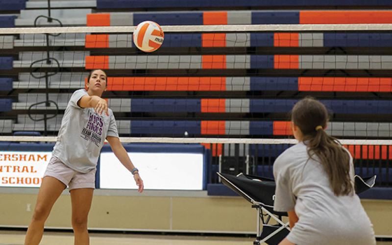 Habersham Central’s Marissa McCallsiter receives down ball from All-American Coach Emily Sheperis during the All-American Camp. (Landen Todd/Staff)
