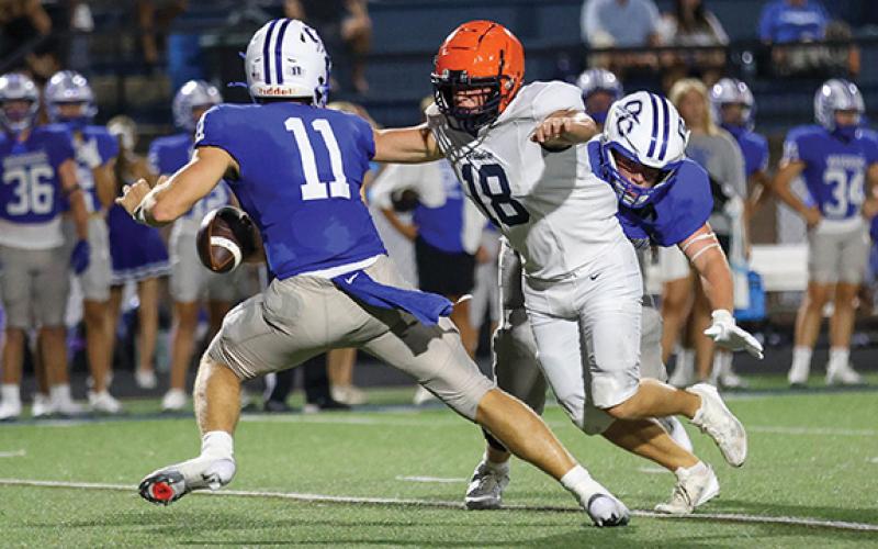 Habersham Central senior Jackson Adams (18) goes after the quarterback during a scrimmage between Habersham Central and Oconee County at Oconee County High School on Friday, Aug. 1. (Landen Todd/Staff)