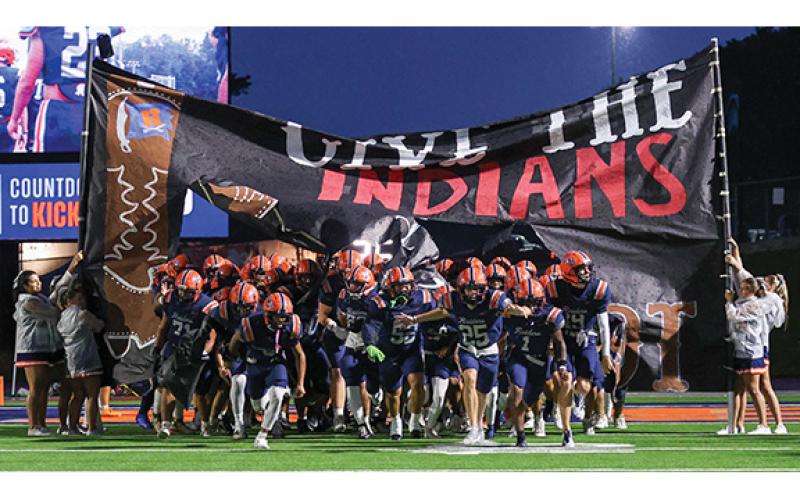 The Raiders storm on the field during the big rivalry opener between Stephens County and Habersham Central at Raider Stadium on Friday, Aug. 15. The Raiders won 27-3. (Landen Todd/Staff)
