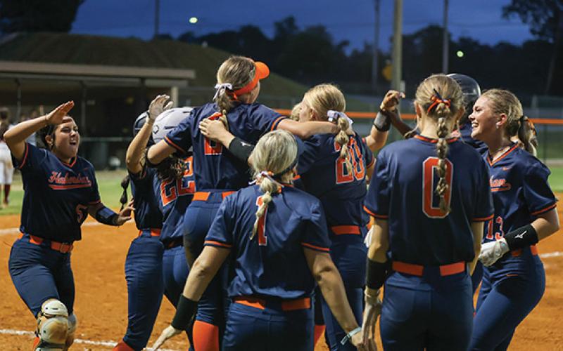 Habersham Central celebrates a walk off during a high school softball game between Johns Creek. (Landen Todd/Staff)