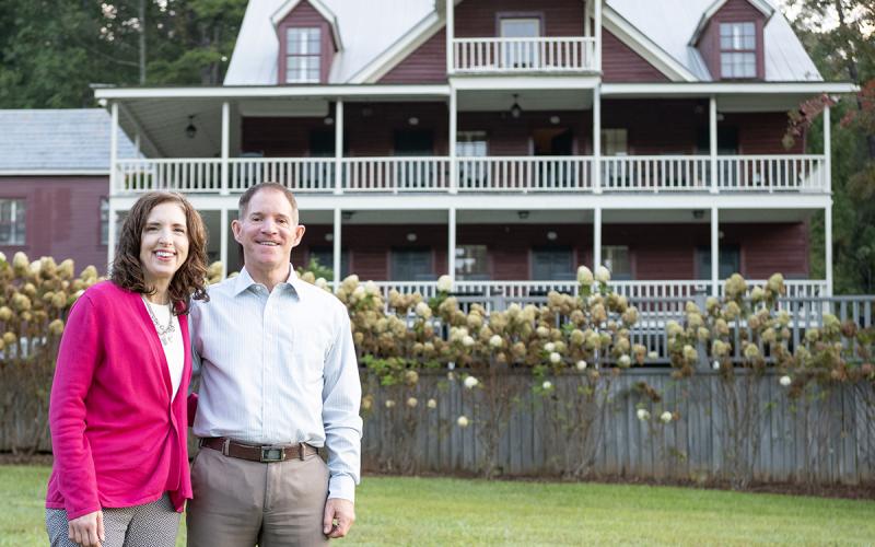 Brian and Michelle Seidling stand on the lawn behind Glen-Ella Springs Hotel. They are the new owners of the property, with a focus on sustainability. (Zach Taylor/Staff)