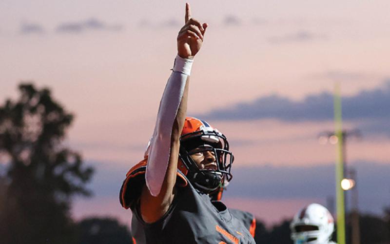 Habersham Central senior running back Donnie Warren (0) points to the sky after scoring a touchdown during the game. (Landen Todd/Staff)