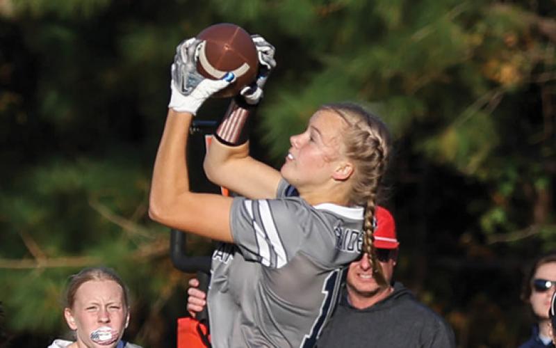 Habersham Central sophomore receiver Macy Huff (15) makes a jumping catch during a flag football game between East Jackson and Habersham Central at Hilliard A. Wilbanks Middle School on Thursday, Oct. 23. (Landen Todd/Staff)