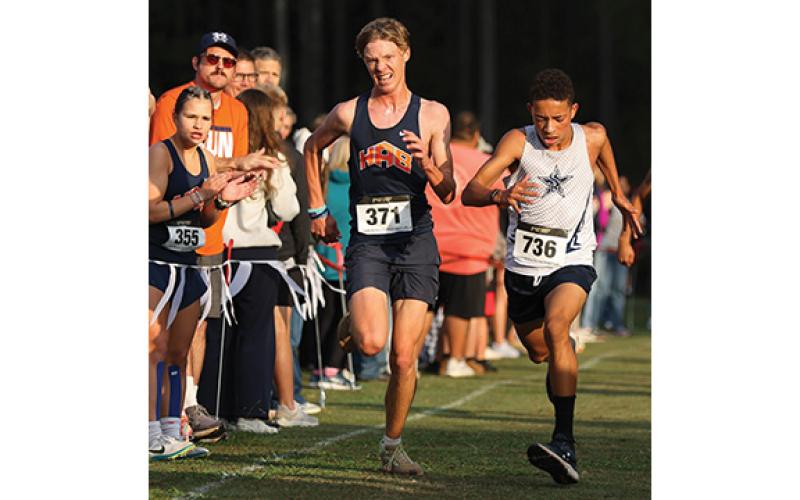 Habersham Central’s Jackson Vonier tries to outrun Ciprian Giamatti during the North Oconee Invitational 2025 on Saturday, Oct. 18. (Landen Todd/Staff)
