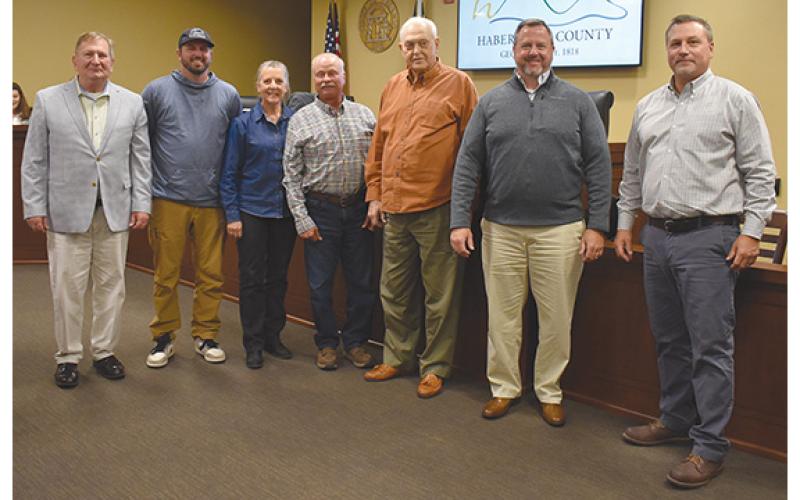 Habersham County Board of Commissioners — Bruce Harkness, Jimmy Tench, Kelly Woodall and Ty Akins —recognizes Farm-City Week with Habersham County Farm Bureau representatives (center) Jared Brooks, Cheryl Kowalsky and Jimmy Kowalsky. (Samantha Sinclair/Staff)