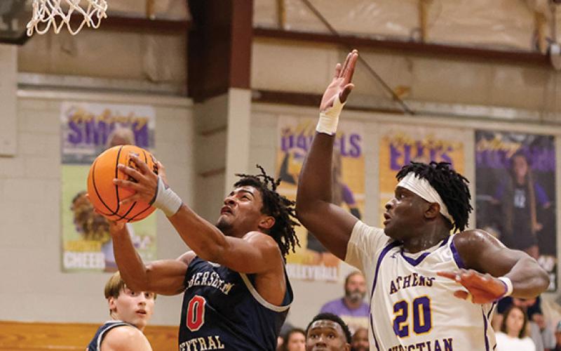 Habersham Central senior guard Donnie Warren (0) goes up for a layup during a basketball game between Habersham Central and Athens Christian at Athens Christian School on Friday, Nov. 21 (Landen Todd/Staff)