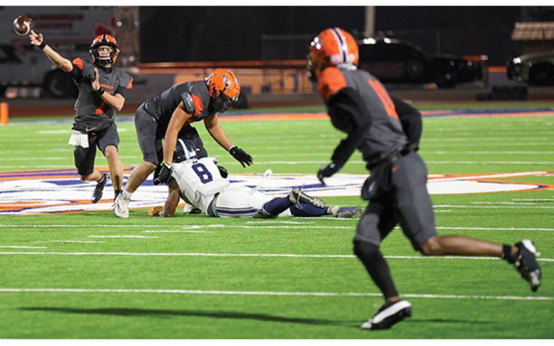 Habersham Central junior quarterback Paris Wilbanks (7) throws the ball to junior wide receiver Jay Feltus (11) during the first round of 5A state playoffs between Statesboro and Habersham Central at Raider Stadium on Friday, Nov. 14. (Landen Todd/Staff)