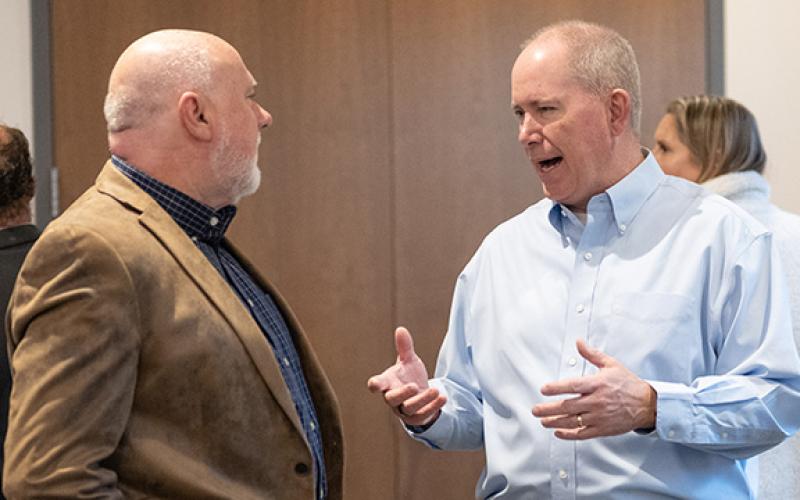 Newly appointed Partnership Habersham Chairman Tommy Thurmond speaks with Tim Ash (left). (Zach Taylor/Staff)