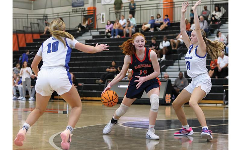 Habersham Central junior Daytona Underwood (14) drives in the paint during the first round of the McDonald’s Shootout Tournament  at Hart County High School on Saturday, Dec. 27. (Landen Todd/Staff)