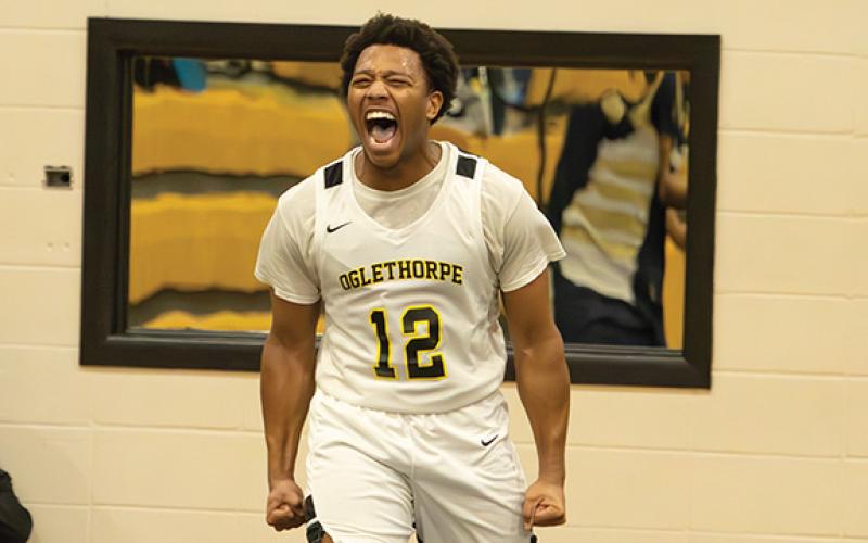 Oglethorpe University senior guard Malachi Dooley celebrates during a college basketball game. Habersham Central basketball alumni Dooley has thrived this past four years at Oglethorpe University and continues to finish strong in his senior year. Dooley recently surpassed 1,000 points scored in a career, which was a goal of his. (Oglethorpe Sports Information/Special)