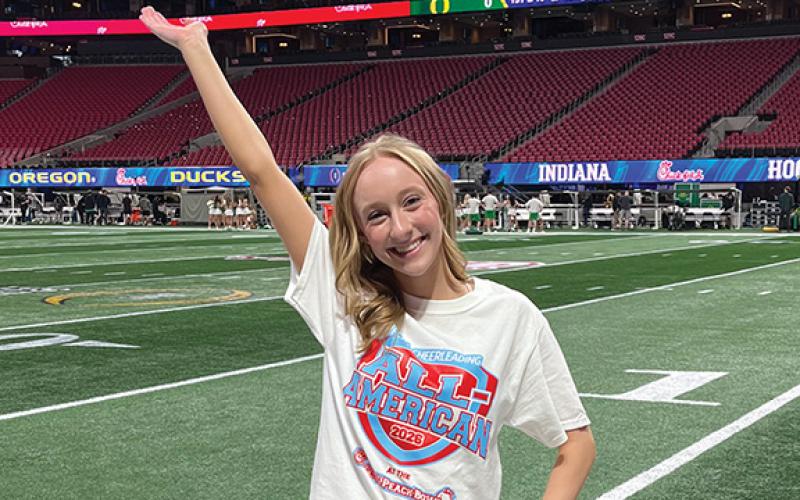 Habersham Central senior Corie Jones poses on the field at the Mercedes-Benz Stadium. The three year All American went through a tryout process to individually perform the All American camp cheer and supreme routine dance in front of a panel of judges. Forty-nine cheerleaders from all across Georgia and surrounding states made the cut. (Submitted)