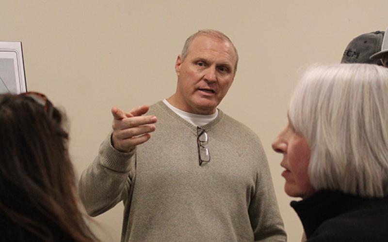 Keith Cook, owner of Cook Construction, explains to community residents and stakeholders details about the potential Duncan Bridge Road project. (Hannah Caudell/Staff)