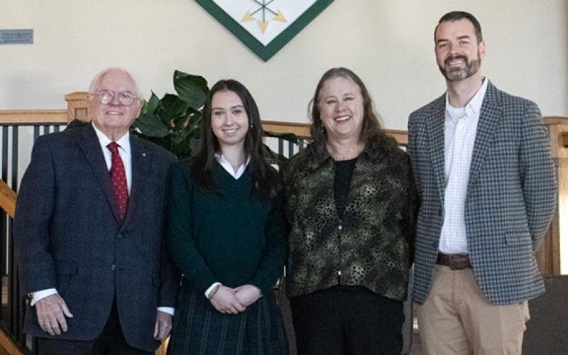 Charlotte Stafford, a TFS senior with an almost impeccable academic track record, has been named this year’s STAR Student for the upper school. Pictured from left are Head of Schools Dr. Larry Peevy, Stafford, STAR Teacher Beth Huebner, and Upper School Academic Dean Jeremy Stille. (Hannah Caudell/Staff)