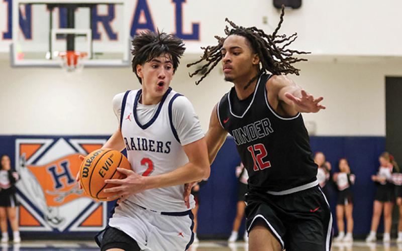 Habersham Central junior guard Eli Maye (2) drives the ball during a basketball game between Winder-Barrow and Habersham Central at the Raider Gymnasium on Friday, Jan. 16. (Landen Todd/Staff)