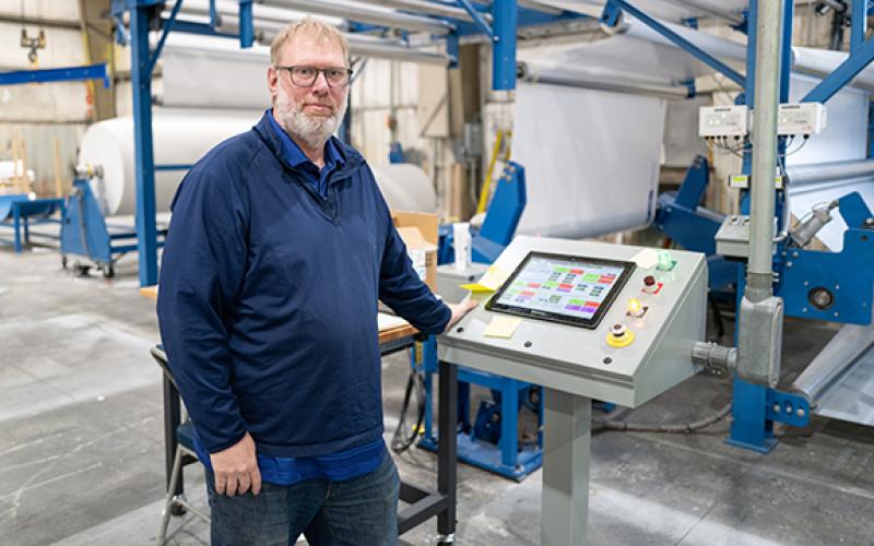 McTech Group Vice President Seth McDonald stands at a console. McTech Group is looking for a permanent home in Habersham County while it temporarily leases a building from Habersham Metal. (Zach Taylor/Staff)