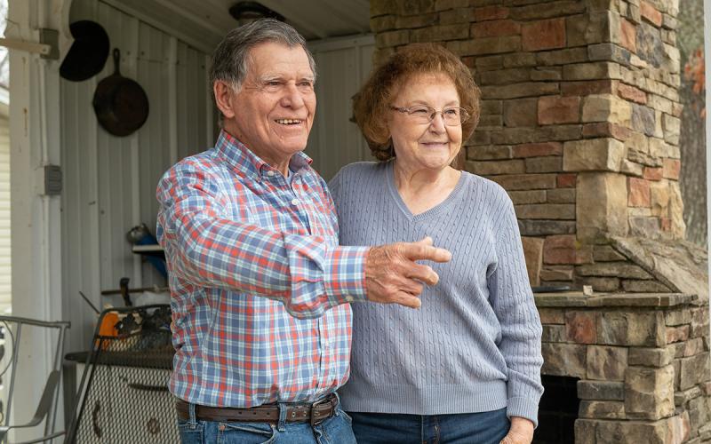Buford and Doris Lewis look at the future of their garden in preparation for spring. Below, school photos show Buford and Doris around the time they were married. (Zach Taylor/Staff)