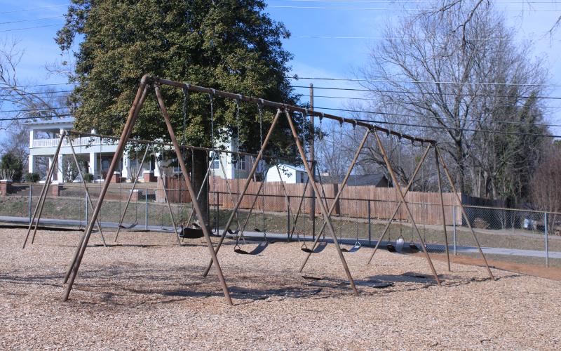 Two old sets of swings sit vacant on the Baldwin  Elementary School playground, waiting for children to fill its seats. The swings could see a potential upgrade with the possible approval of ESPLOST VII by county voters. (Hannah Caudell/Staff)