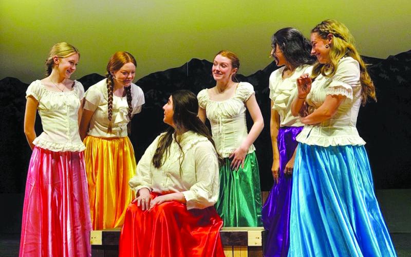 The brides (Sari Elliott, Elloree Chambers, Ashley Jones, Kayla Rummel and Annalee Lewis) gather around Milly played by Aliyah Duncan. (Callie Cueva/Staff)