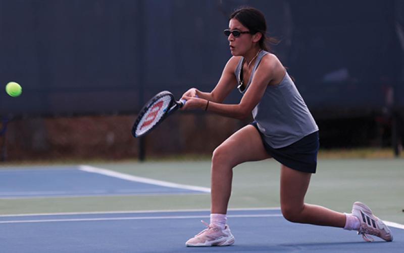 Habersham Central junior Kailey Otero hits the ball during a tennis match between Winder-Barrow and Habersham Central at Habersham Central High school on Tuesday, March 10. (Landen Todd/Staff)