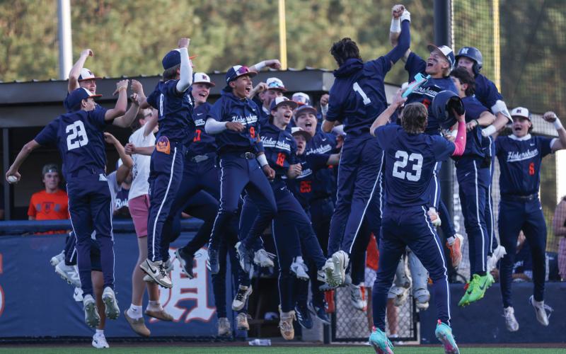 Habersham Central senior infielder Carter Crane (1) celebrates a home run with the team during a baseball game between Apalachee and Habersham Central at Raider Park on Friday, March 27. (Landen Todd/Staff)