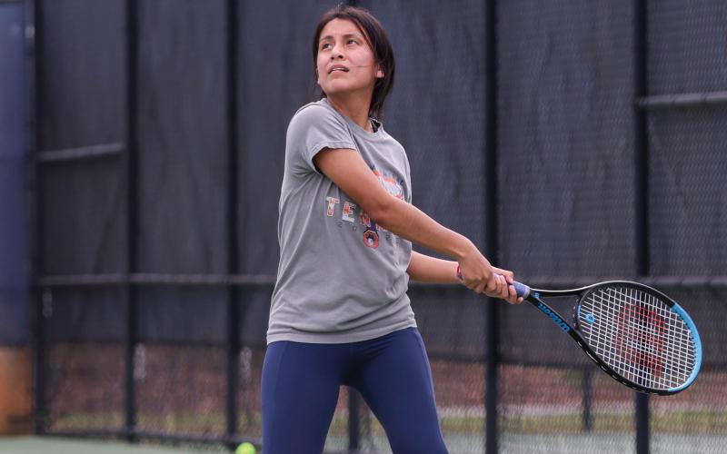 Habersham Central junior tennis player Kailey Otero hits the ball during a region tournament match-up between Apalachee and Habersham Central at Habersham Central High School on Monday, March 30. (Landen Todd/Staff)