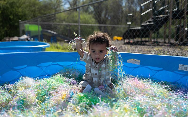Titus Newton plays in tinsel at Mt. Carmel Baptist Church’s Easter celebration. ZACH TAYLOR/Staff