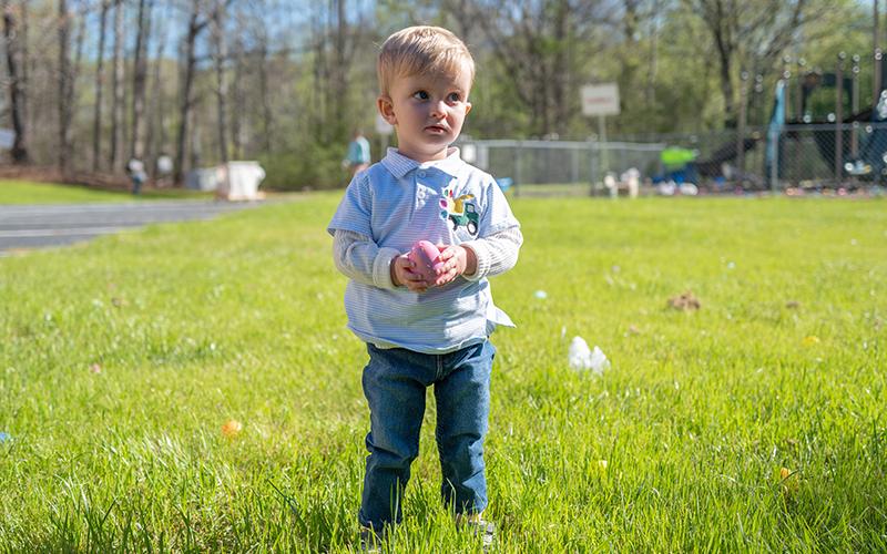 Collin Lawrence picks up eggs during the Mt. Carmel Baptist Church Easter egg hunt. ZACH TAYLOR/Staff