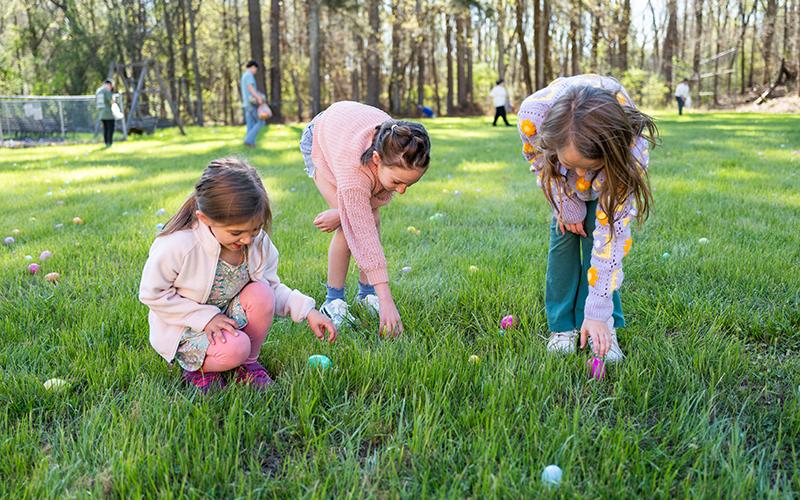 Rynlee Leviner, Lizzie Heintz and Scotty Taylor search for eggs at Mt. Carmel Baptist Church’s Easter egg hunt. ZACH TAYLOR/Staff