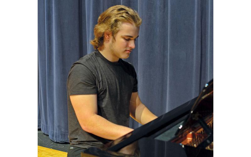 Terrell Miller of The Blue Room Boys plays the piano. (Callie Cueva/Staff)
