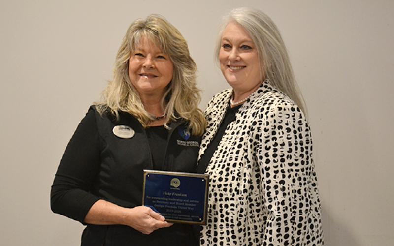 Vicky Frankum and Georgia Foothills United Way President and CEO Shelby Ward smile for a photo after the organization honored Frankum with an award for her time serving as the United Way secretary and board member for seven years. (Hannah Caudell/Staff)
