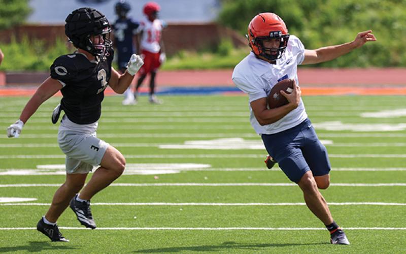 Habersham Central rising senior quarterback Paris Wilbanks (7) makes a big time run during a scrimmage at Raider Stadium on Wednesday, June 24. (Landen Todd/Staff)