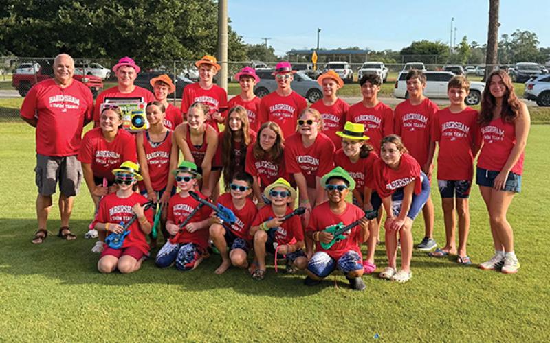 The 2026 Habersham County state swim team includes (front row) Ryelin London, Jonah McEntire, Grayson Free, Rowan Schofill, Omar Nunez, (second row) AbbyGrace Head, Ava Free, Kayleigh McEntire, Naomi Russo, Emmeline Penland, Ellie Gates, Adalynn Sheffield, Adalyn Reynolds, (back row) Coach Mike Krippner, Noah Reynolds, Elliott Rudeseal, Lincoln Penland, Luke Russo, Logan Thompson, Jameson Thompson, Ty Beack, Brody Kastner, Lucus Woodworth and Coach Sadie Hagel pose at the State Swim Meet in Moultrie.
