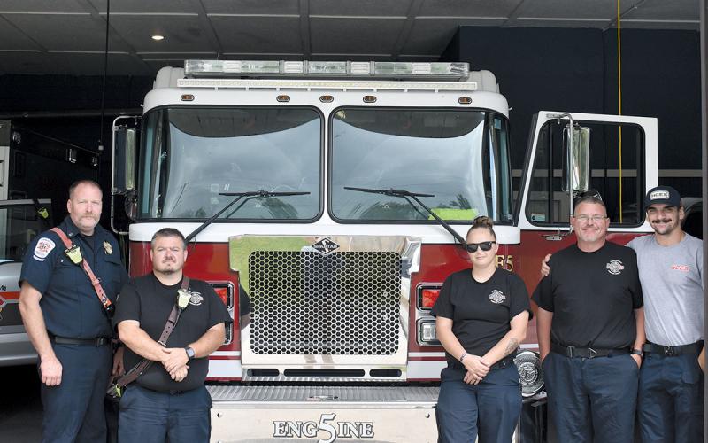 Station 5’s Brandon Whitney, Keith Borton, Kayden Harper, Tyler Downs and Kyle Cash continue working as station renovations near completion. (Noah Ansley/Staff)