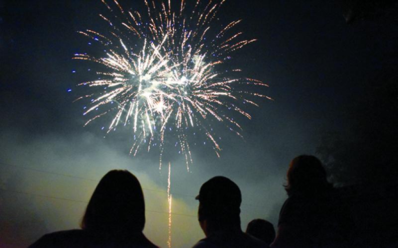 Fireworks explode high above the ballfield as firefighters and their families got front row seats to the show at Demorest’s Glorious Fourth of July last year. (Samantha Sinclair/Staff)