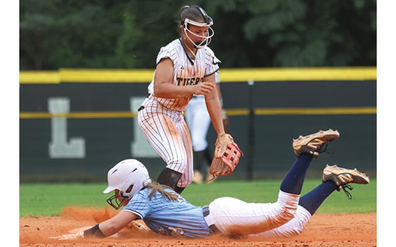Habersham Central outfielder Sydney McCalmon (23) slides in safely during the softball game between Habersham Central and Commerce at American Veterans Memorial Park on Wednesday, Aug. 5. (Landen Todd/Staff)