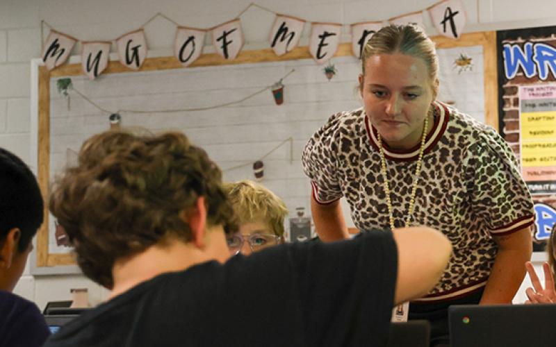 PresLee Hix, an English Language Arts co-teacher at South Habersham Middle School, helps one of her students with an assignment during class Wednesday. (Hannah Caudell/Staff)
