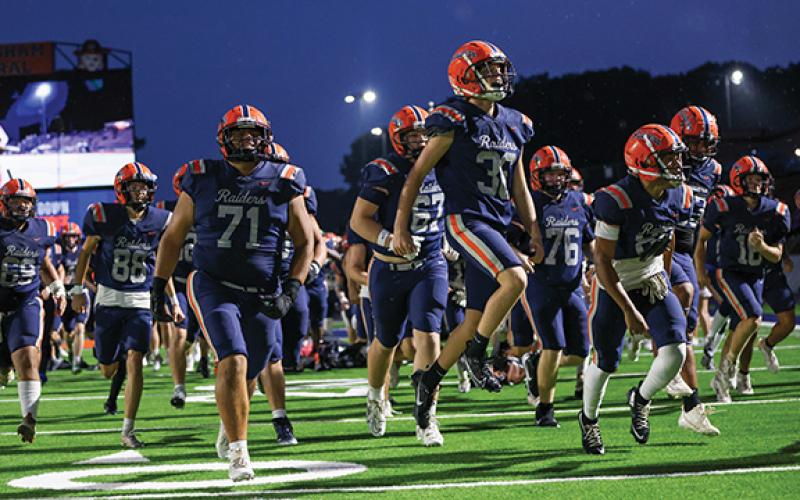 The Habersham Central Raiders run onto the field during last year’s season. (Landen Todd/Staff)