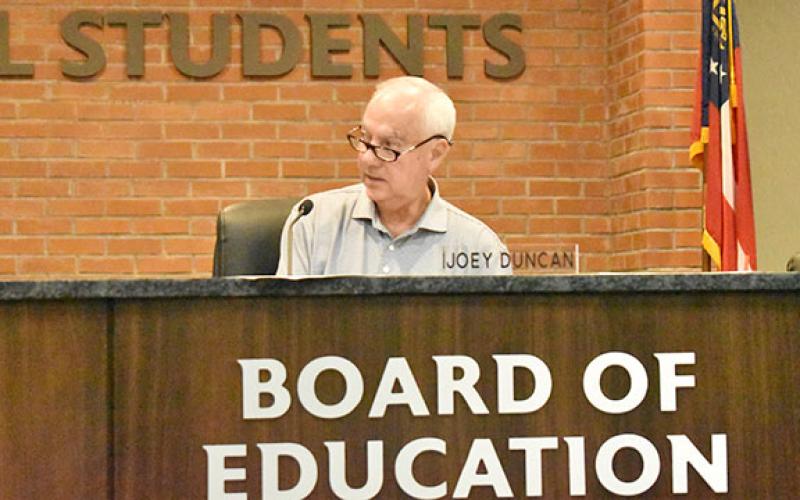 Habersham County Board of Education Chairman Joey Duncan asks for a motion to approve the donation of surplused property to Rabun County E-911 during Monday night's regular meeting. (Hannah Caudell/Staff)