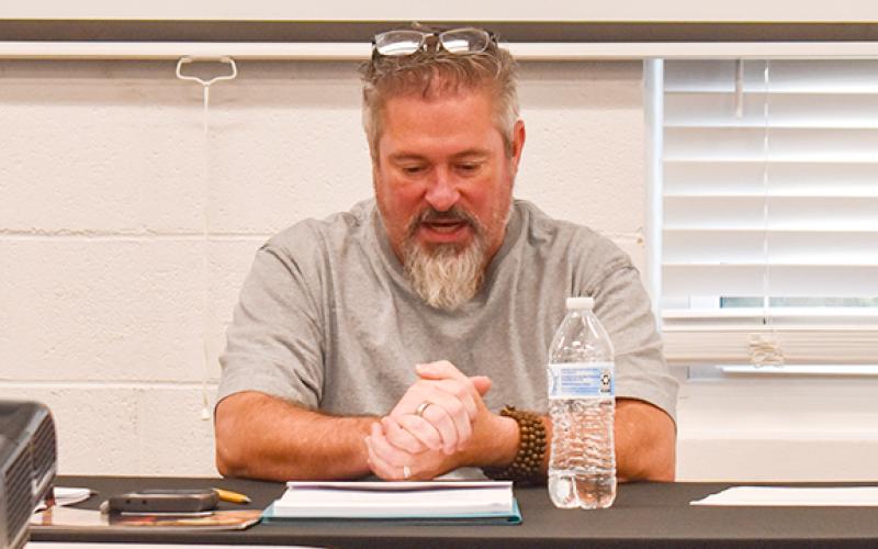 Tallulah Falls Mayor Mike Early reads council's prepared statement regarding Mike Urpschot's resignation from council. (Hannah Caudell/Staff)