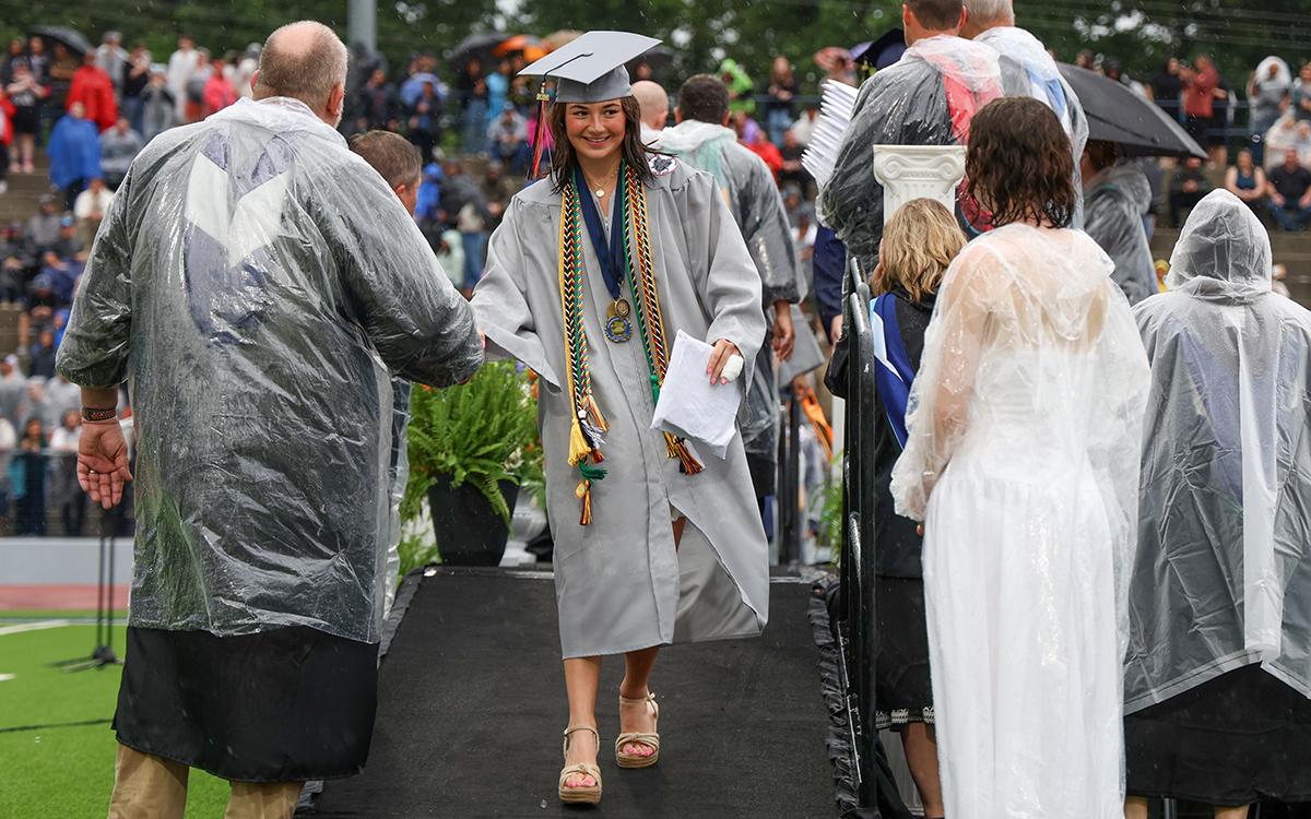 HCHS graduate Rainlan Hobson walks off the stage after receiving her diploma at Raider Stadium Friday, May 22. (Landen Todd/Staff)