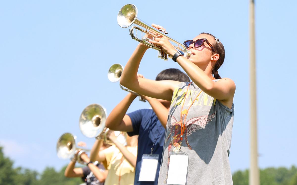Taylor Pass plays trumpet in time with the other wind ensemble players during band practice on Thursday morning. (Hannah Caudell/Staff)