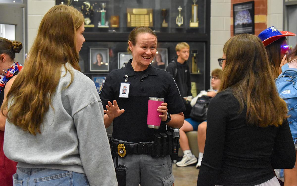 Habersham Central School Resource Officer Victoria Hopper (middle) converses with students before the 8 a.m. bell rings on Thursday morning. (Hannah Caudell/Staff)