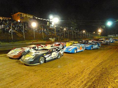 Cars running two across roar down the straightaway during a feature race at Toccoa Raceway. Photo racingin.com