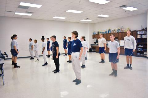 Students lead the class with stretch exercises to start off physical training, which the Air Force Junior Reserve Officer Training Corps at Habersham Central High School has every Friday.