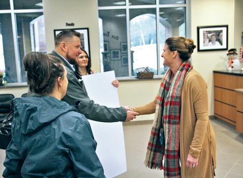 Laura Anderson, Josh Anderson and Angie  Wingo with North Georgia Home Group meet with Fairview Elementary School Principal Jennifer Chitwood to present a check to pay off the outstanding lunch balances for students.
