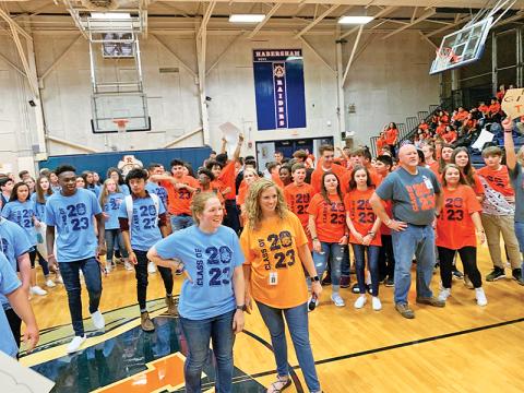 Physical education teacher Lindsay Herrin (front right) and math teacher Hannah Blalock (front left) help judge a dance competition during a Battle of the Houses at Habersham Ninth Grade Academy. 