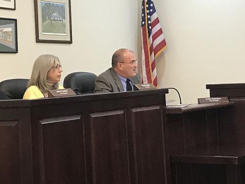 New Clarkesville city manager Keith Dickerson reports to the council Monday night as city clerk Glenda Smith looks on.
