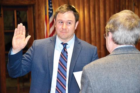New Cornelia Mayor John Borrow is sworn in Tuesday night before the commission meeting.